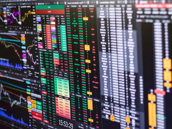 Detailed financial trading screen with colorful charts and data representing market fluctuations.